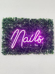 Nails Neon Sign with Grass Wall Backdrop
